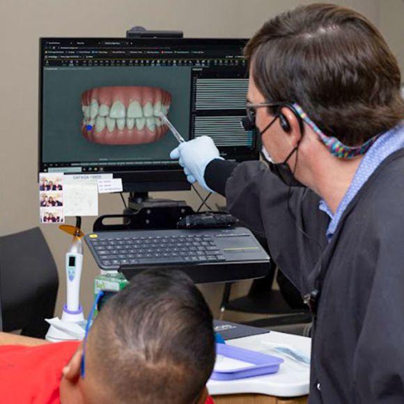 Image of Dr. Ron Wilson discussing orthodontic treatment with a patient in Gainesville, GA | Wilson Orthodontics