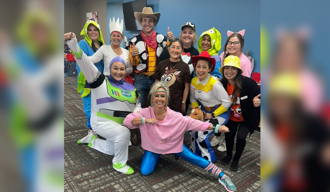 Dr. WIlson and Team pose for a picture wearing costumes - Wilson Orthodontics Gainesville, GA